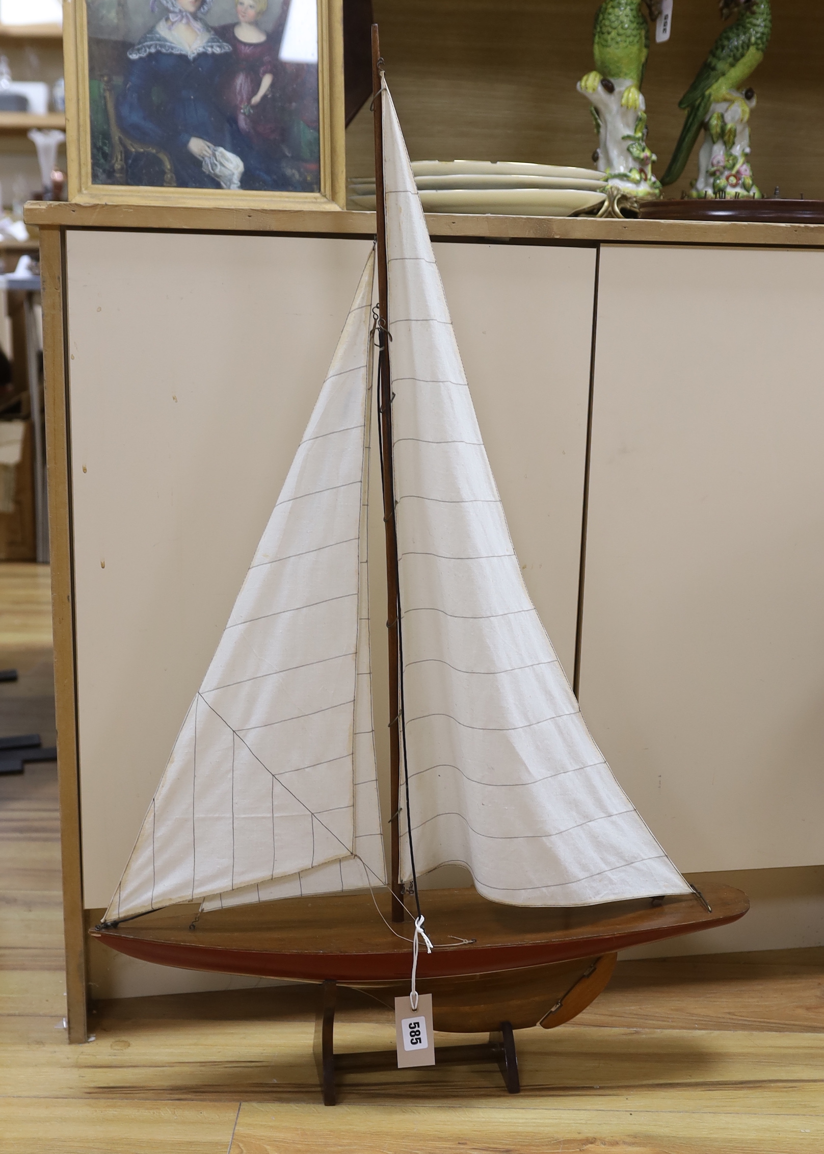 A painted wood pond yacht with fabric sails on stand, 97cm high